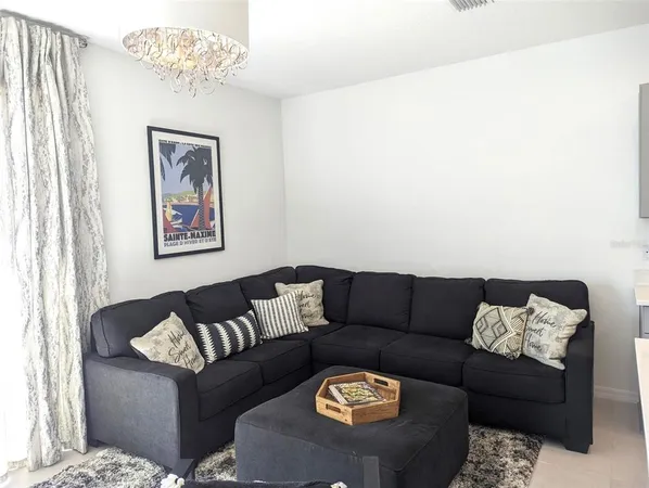 a living room with furniture and a couch