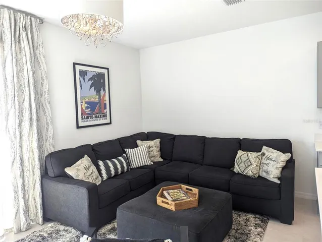 a living room with furniture and a couch