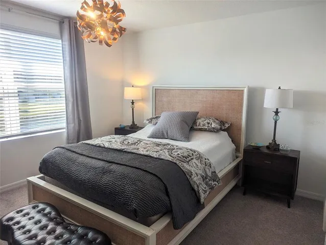 a room with a flat screen tv cabinet and a wall