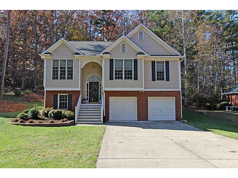 3735 Nowlin Road Kennesaw, GA 30144 - Photo 1 of 1 a front view of a house with a garden