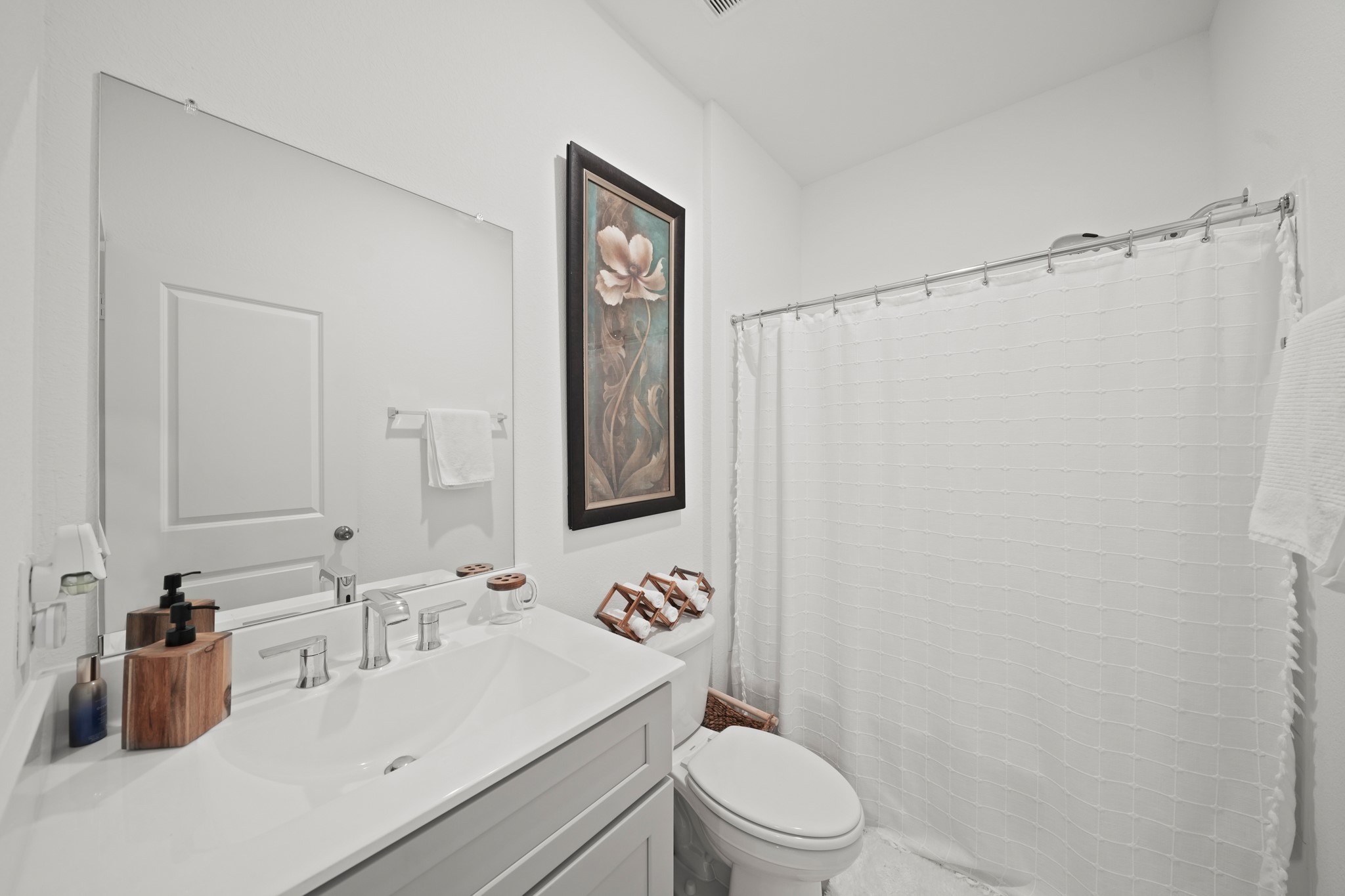 26235 Arrowleaf Drive Magnolia, TX 77355 - Photo 15 of 32 a bathroom with a sink a toilet and shower