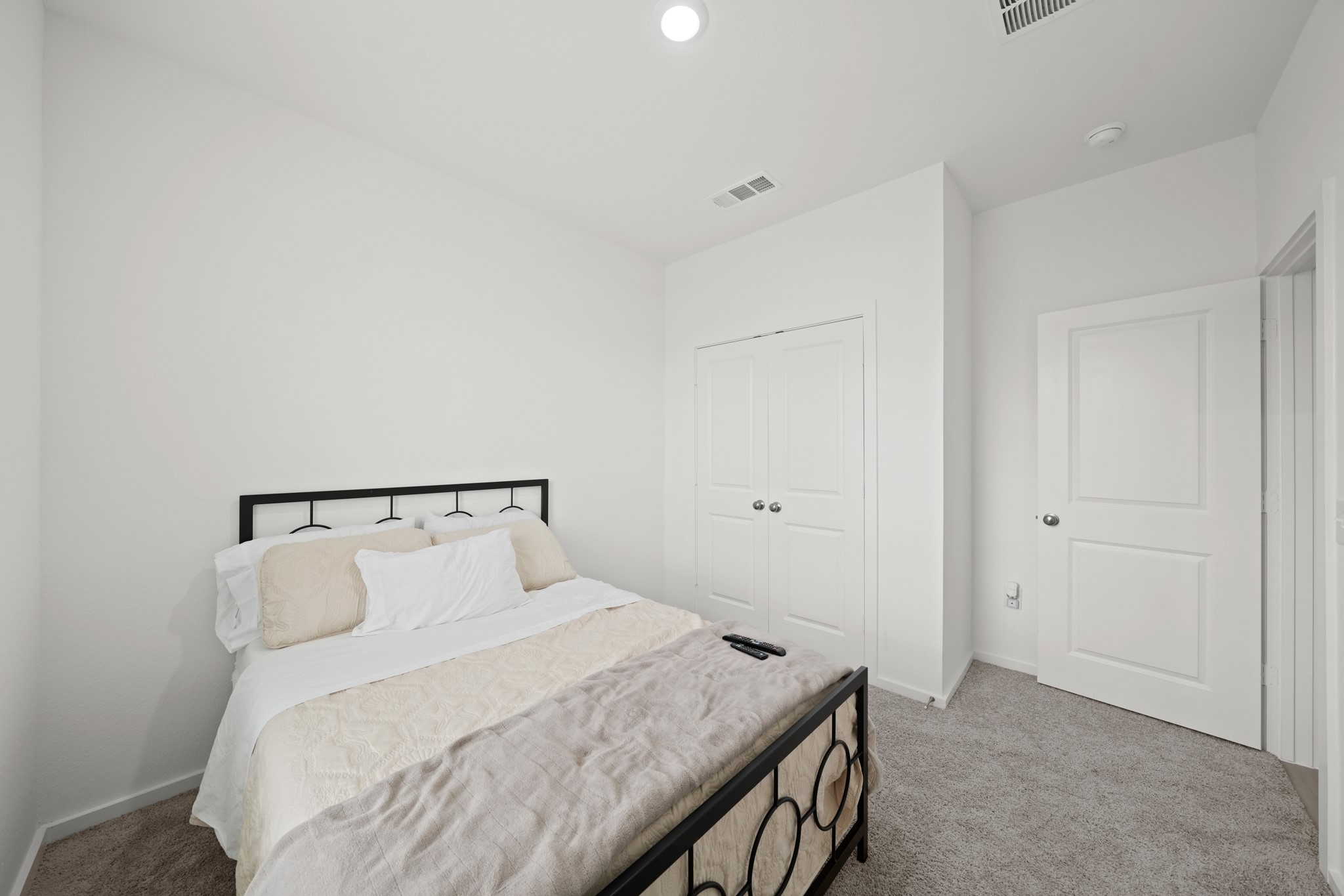 26235 Arrowleaf Drive Magnolia, TX 77355 - Photo 17 of 32 a bedroom with a bed and a night stand