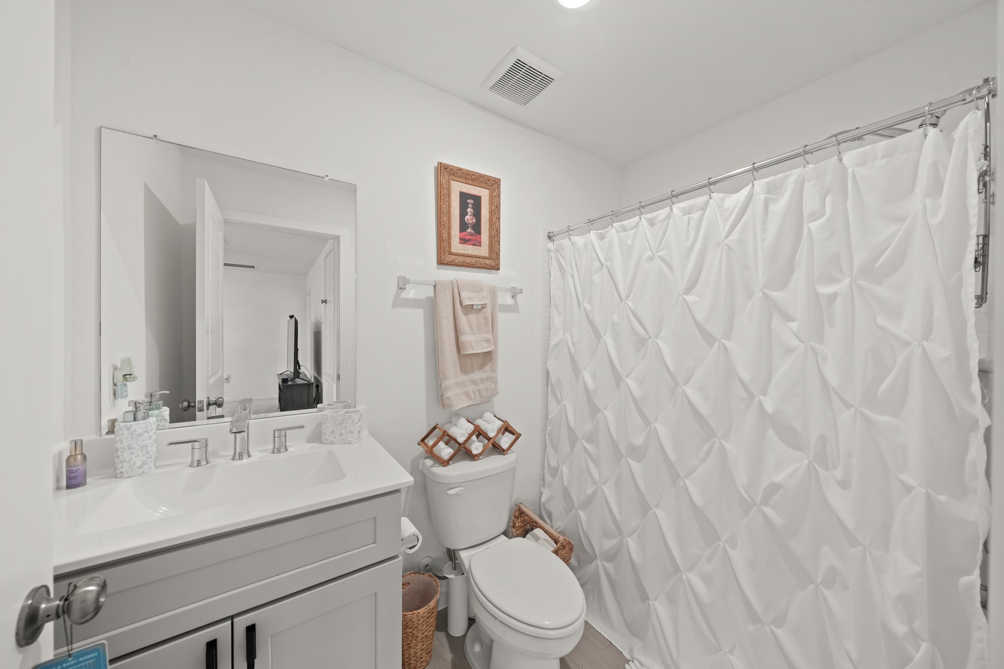 26235 Arrowleaf Drive Magnolia, TX 77355 - Photo 18 of 32 a bathroom with a sink a toilet and a mirror