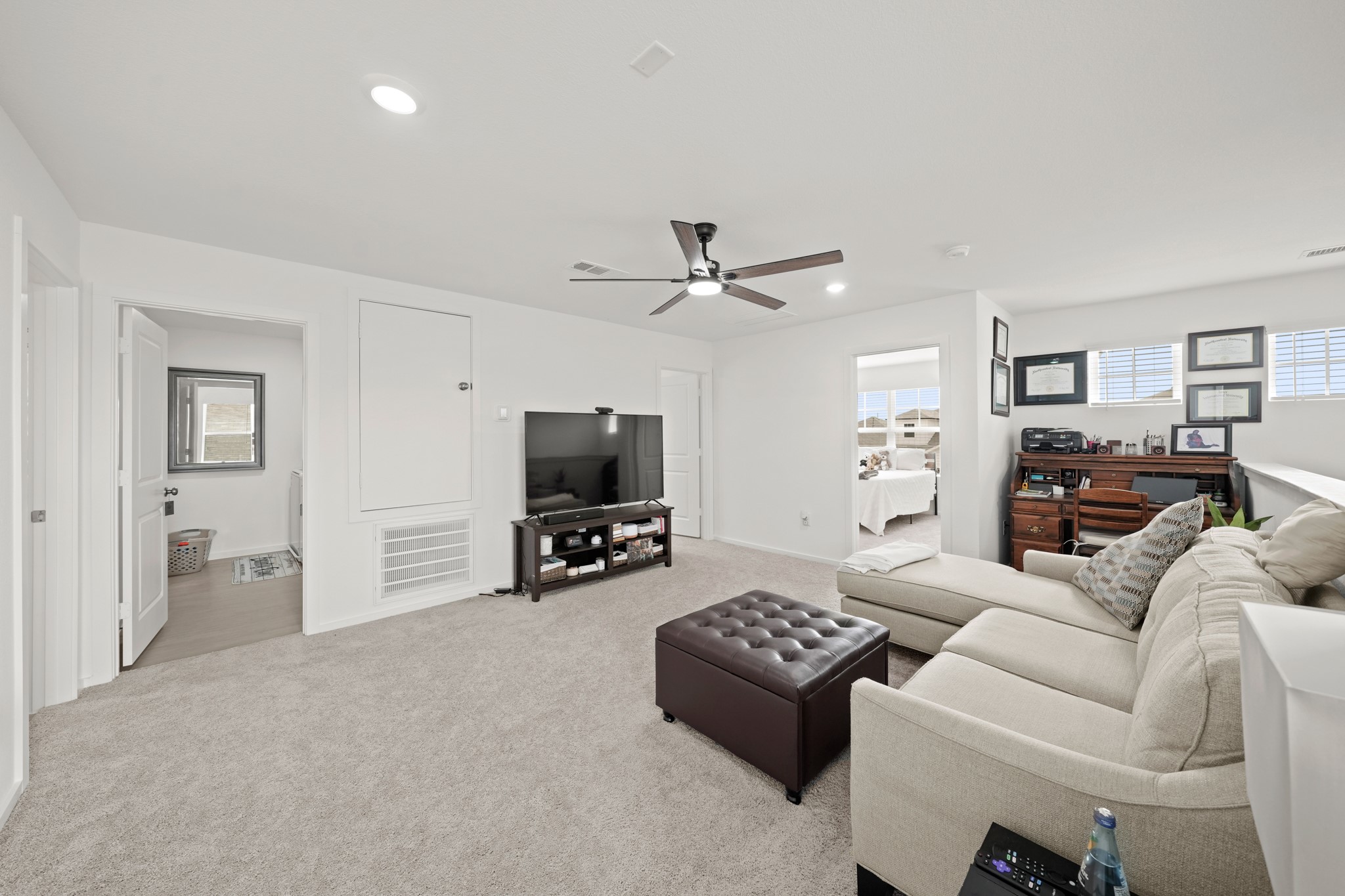 26235 Arrowleaf Drive Magnolia, TX 77355 - Photo 20 of 32 a living room with furniture and a flat screen tv