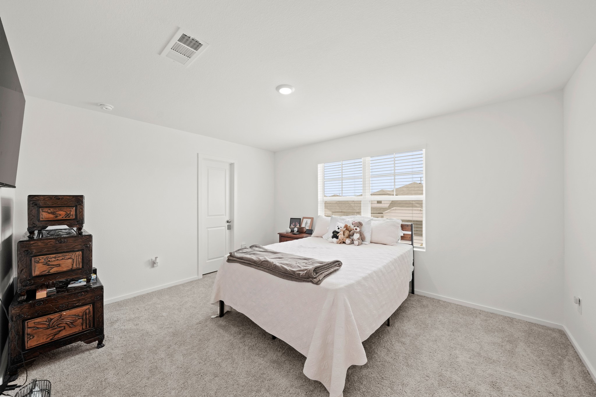 26235 Arrowleaf Drive Magnolia, TX 77355 - Photo 26 of 32 a bedroom with a bed and a window