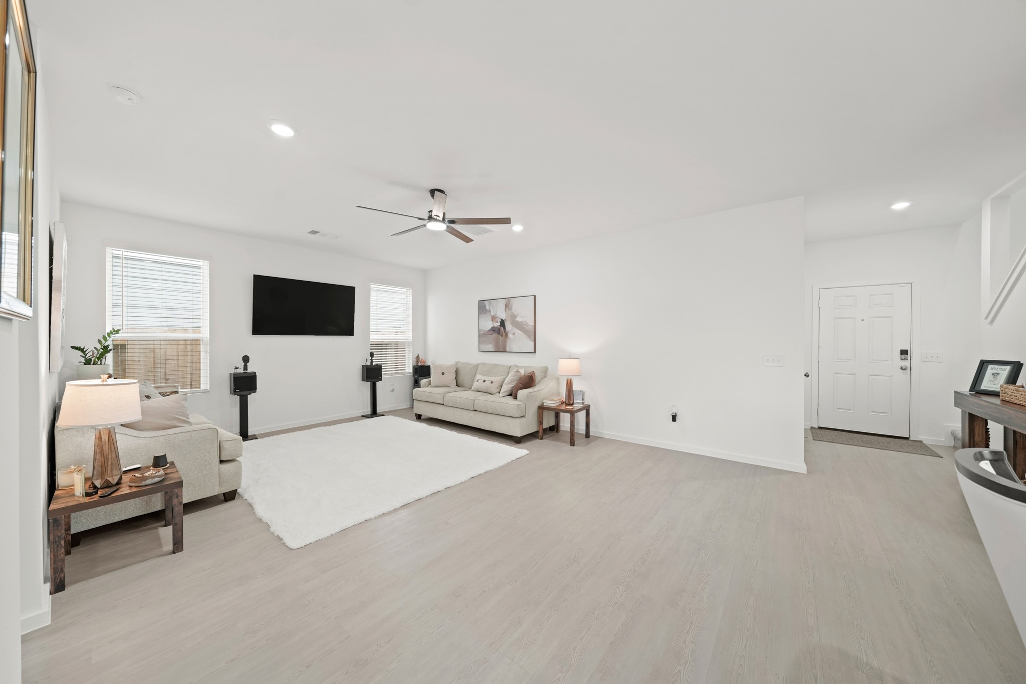 26235 Arrowleaf Drive Magnolia, TX 77355 - Photo 8 of 32 a living room with furniture and a flat screen tv