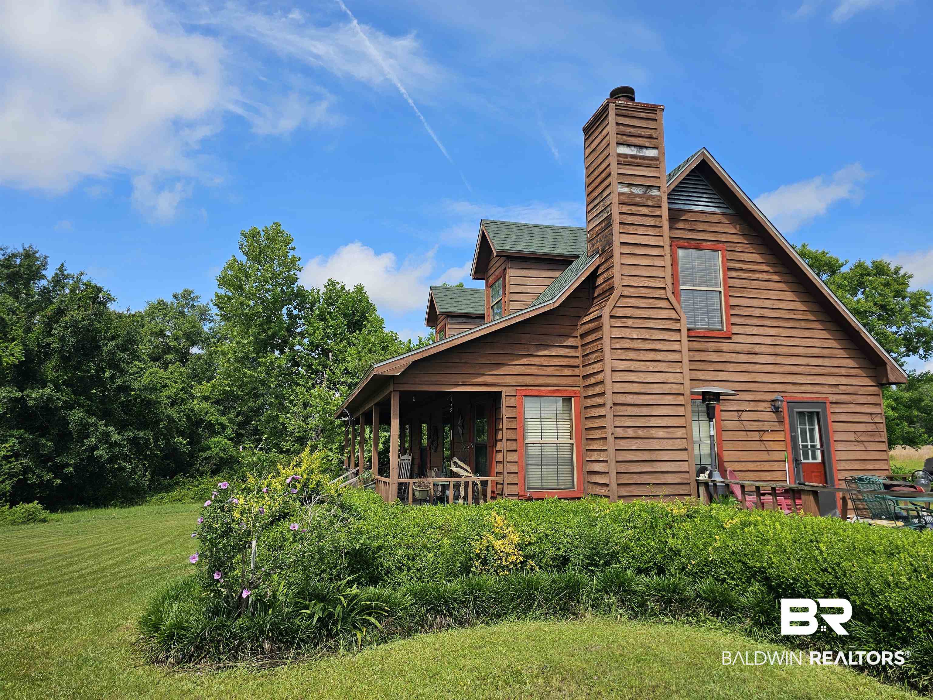 1818 Old Fannie Road Flomaton, AL 36441 - Photo 5 of 20 View of home's exterior with a chimney and a yard