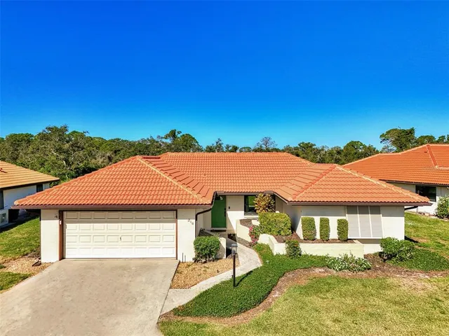 a view of yard with swimming pool and green space