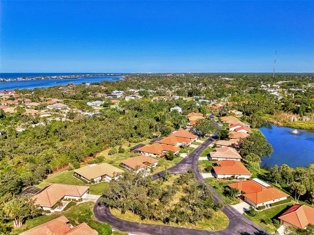 a aerial view of a house with yard and outdoor seating