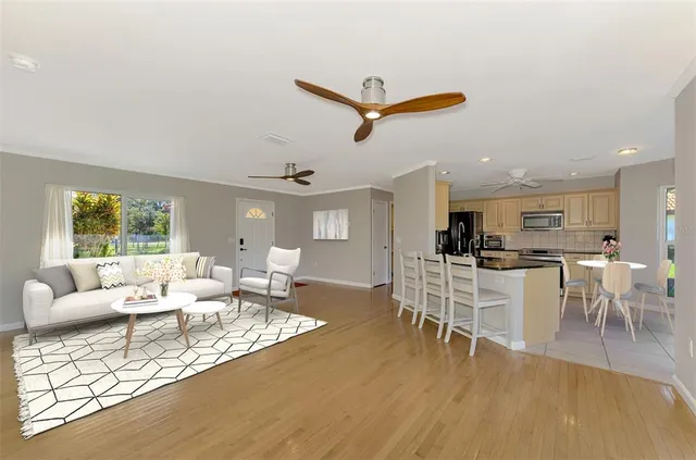 a living room with a hard wood floor