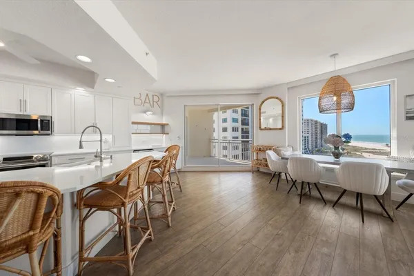 a view of a dining room with furniture and wooden floor