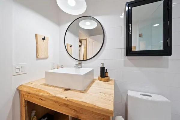 a bathroom with a bathtub and a mirror