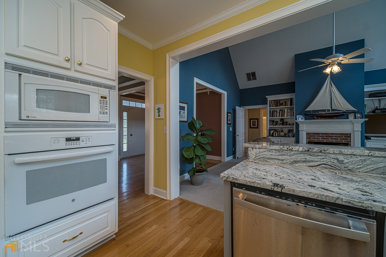 928 Grayson New Hope Road Lawrenceville, GA 30045 - Photo 25 of 36 a kitchen with stainless steel appliances granite countertop a stove and a microwave