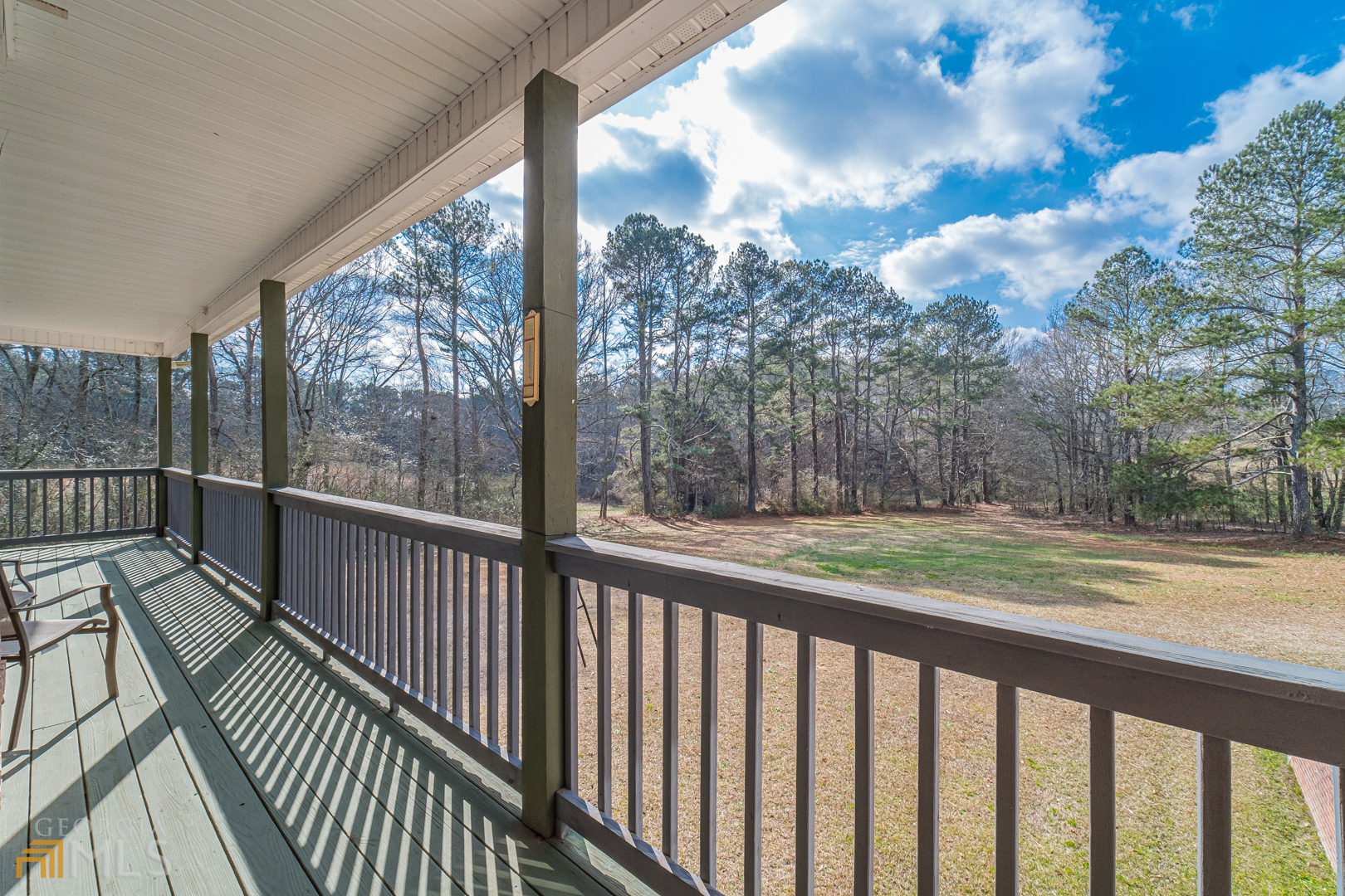 928 Grayson New Hope Road Lawrenceville, GA 30045 - Photo 29 of 36 a view of a porch with wooden floor and wooden fence