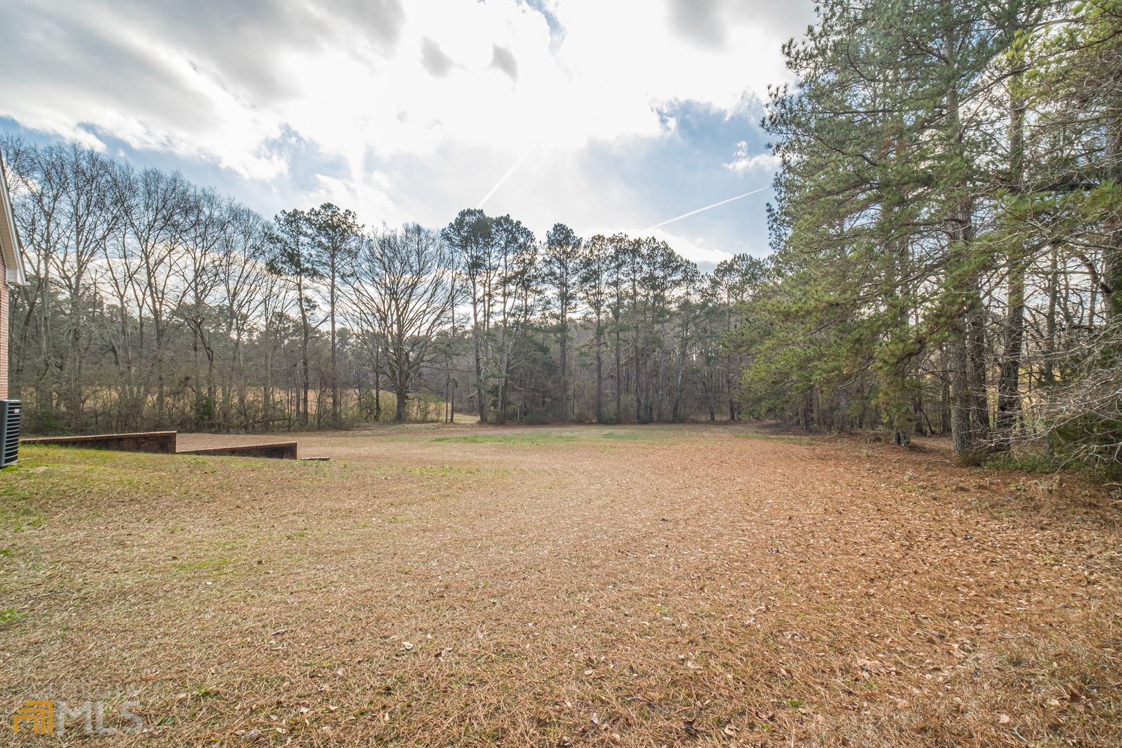 928 Grayson New Hope Road Lawrenceville, GA 30045 - Photo 35 of 36 a backyard of a house with trees