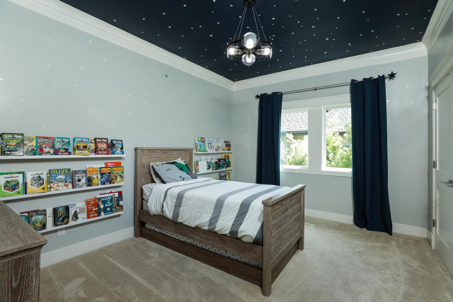 818 Crossway Road Burlingame, CA 94010 - Photo 15 of 50 a bedroom with a bed and a book shelf