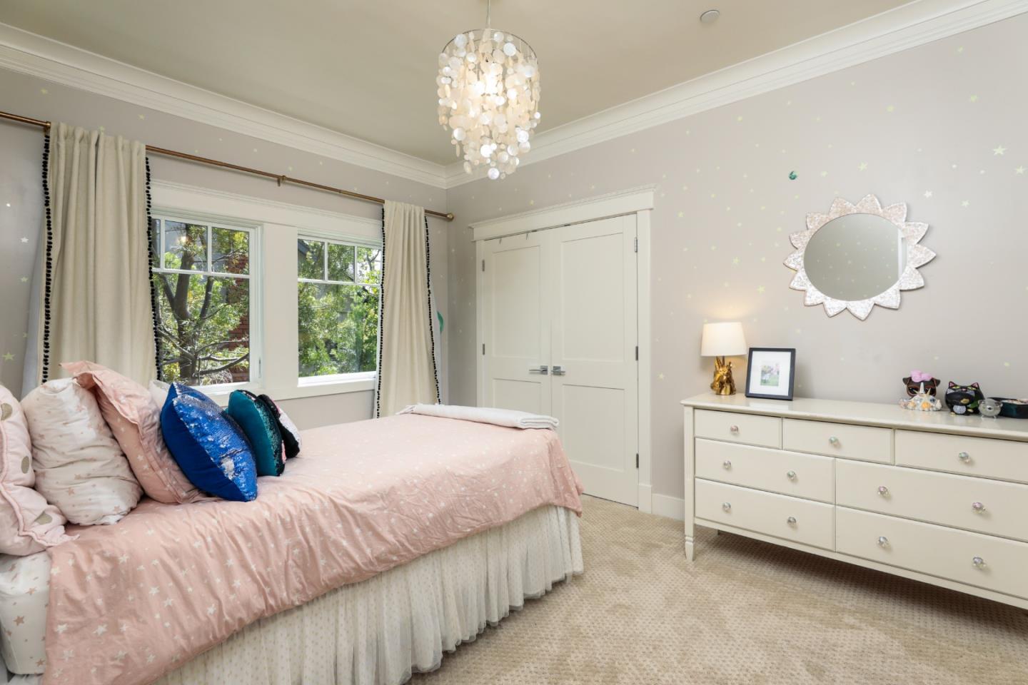 818 Crossway Road Burlingame, CA 94010 - Photo 16 of 50 a bedroom with a large bed and a chandelier