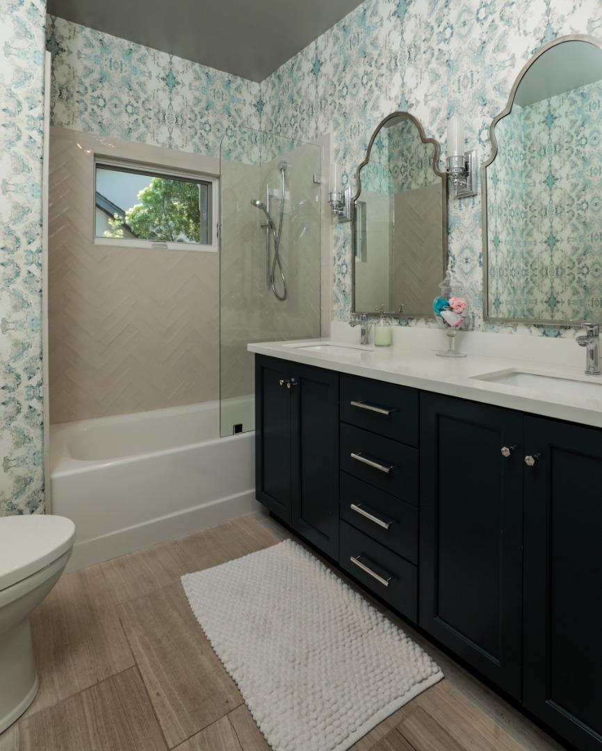 818 Crossway Road Burlingame, CA 94010 - Photo 17 of 50 a bathroom with a double vanity sink toilet and shower