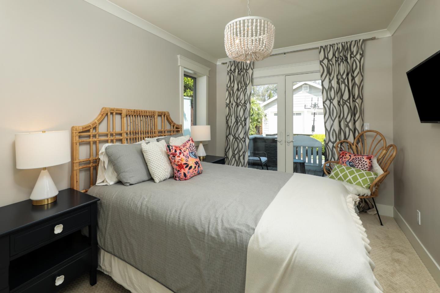 818 Crossway Road Burlingame, CA 94010 - Photo 18 of 50 a bedroom with a bed and a chandelier