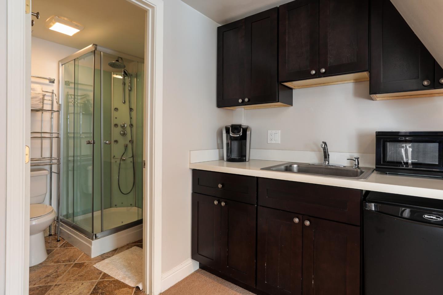 818 Crossway Road Burlingame, CA 94010 - Photo 26 of 50 a kitchen with stainless steel appliances granite countertop a refrigerator and a sink