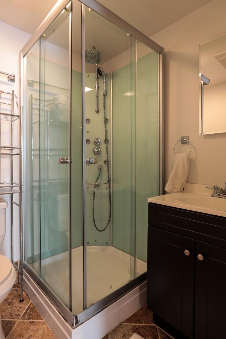 818 Crossway Road Burlingame, CA 94010 - Photo 27 of 50 a bathroom with a shower and a sink
