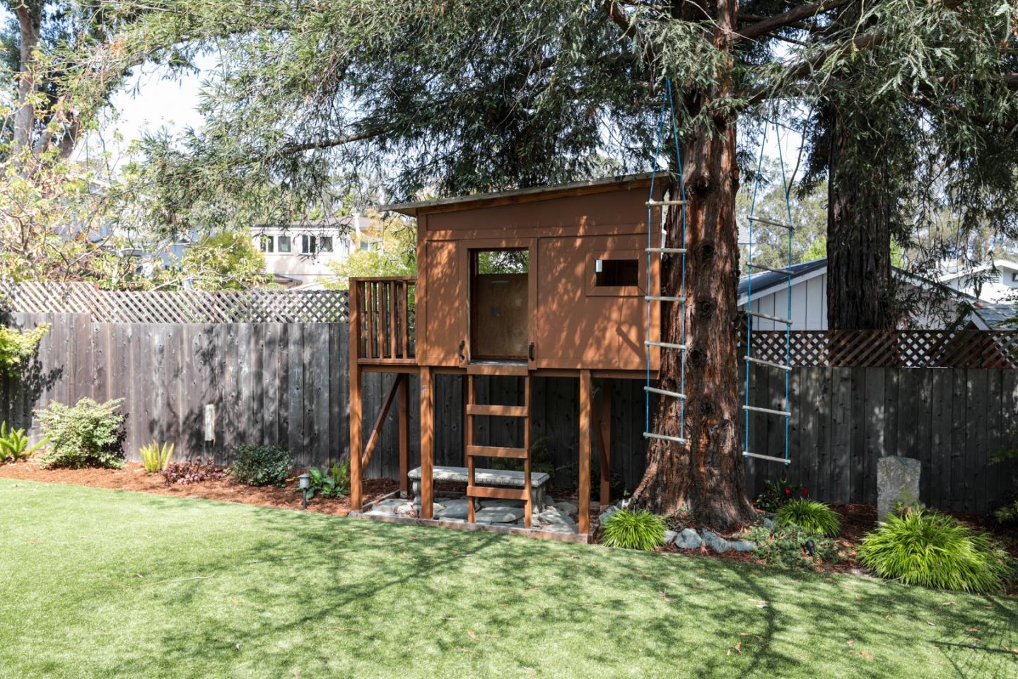 818 Crossway Road Burlingame, CA 94010 - Photo 35 of 50 a view of a house with a yard and sitting area