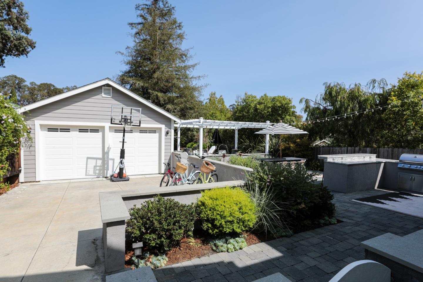 818 Crossway Road Burlingame, CA 94010 - Photo 48 of 50 a view of a house with backyard sitting area and garden
