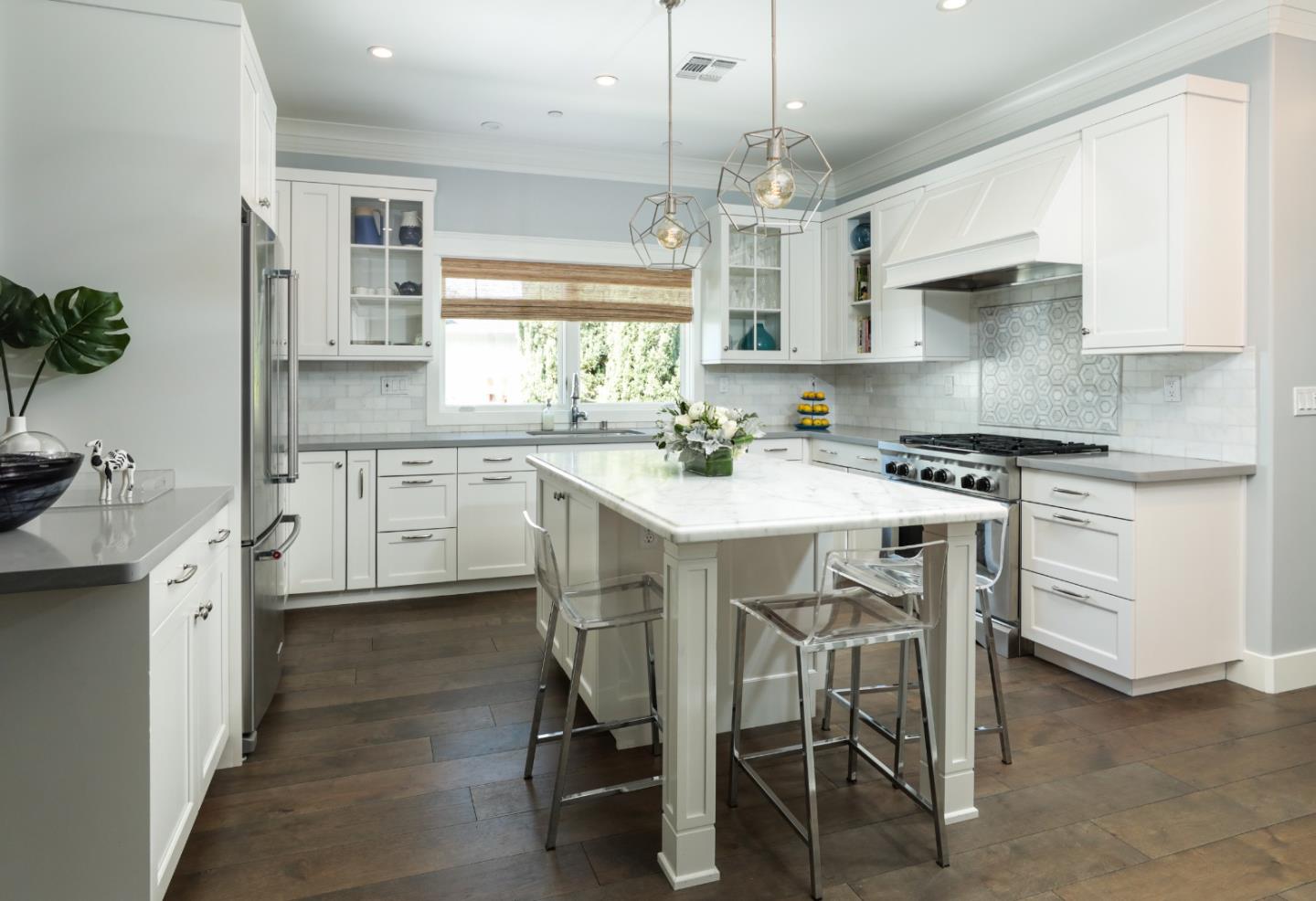 818 Crossway Road Burlingame, CA 94010 - Photo 7 of 50 a kitchen with a table chairs stove and cabinets