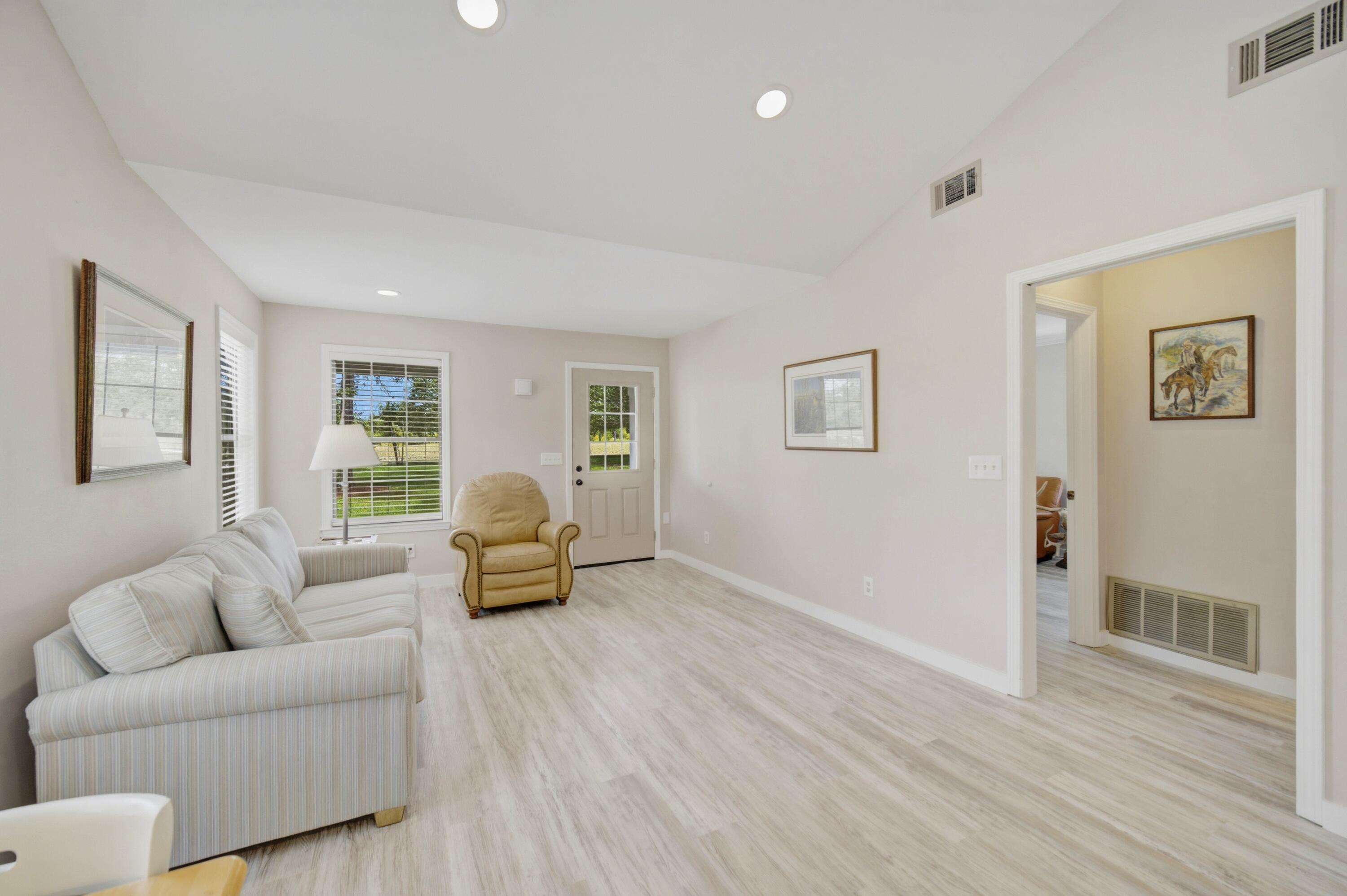 261 Wilkerson Road DeFuniak Springs, FL 32433 - Photo 52 of 76 a living room with furniture and a wooden floor