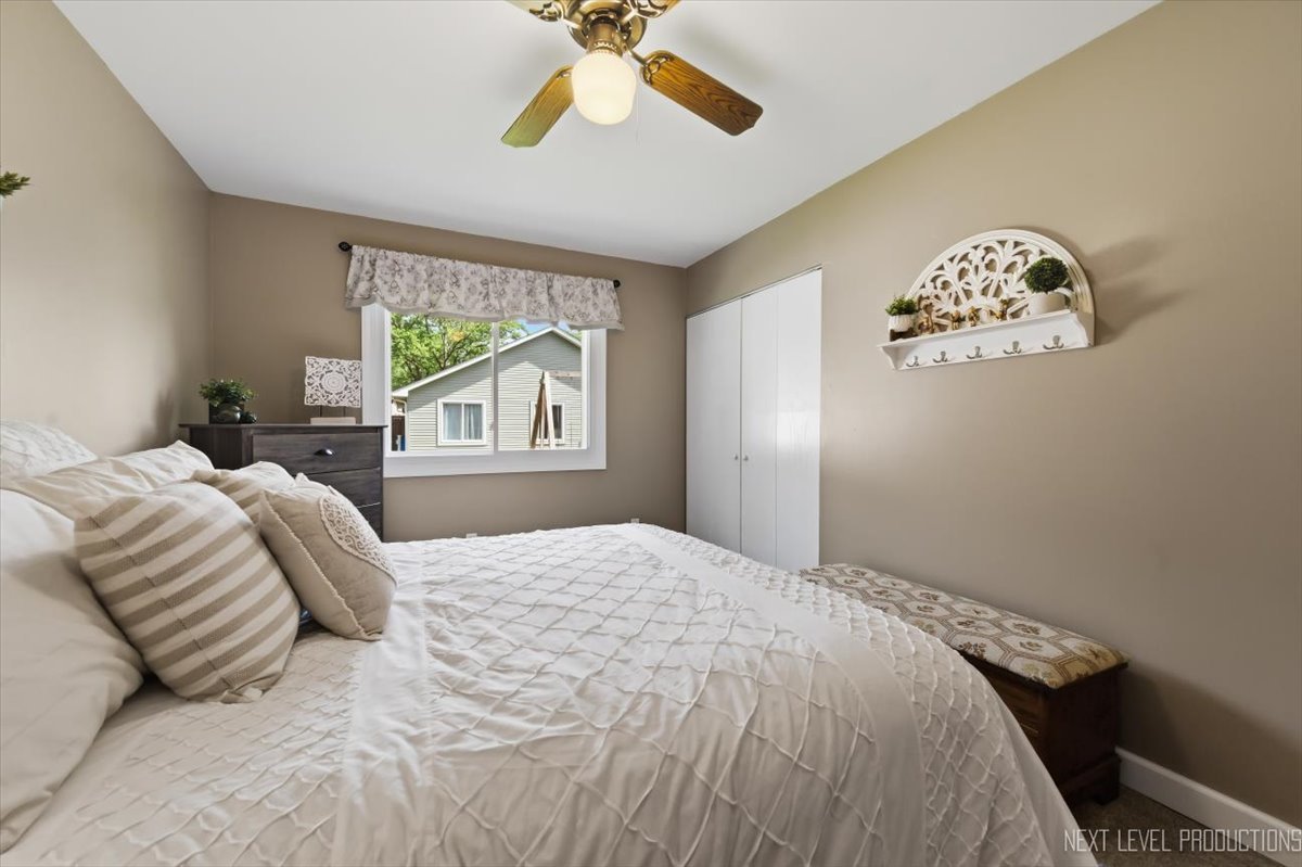 10 Shermead Road Montgomery, IL 60538 - Photo 14 of 30 a bedroom with a large bed and a window