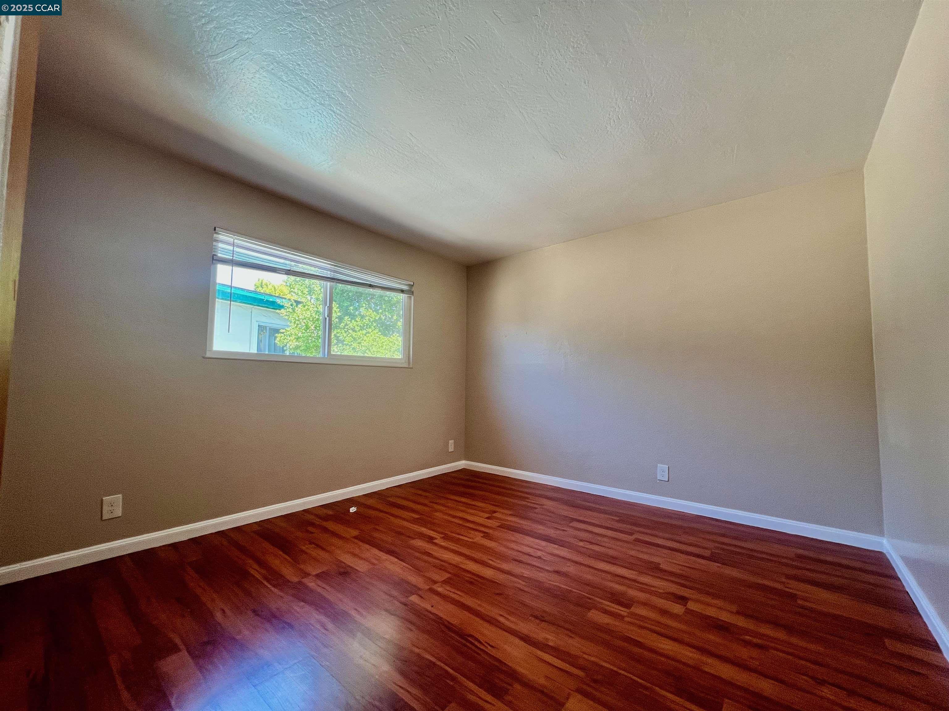 2546 Denning Court Castro Valley, CA 94546 - Photo 11 of 14 a view of room with wooden floor and window
