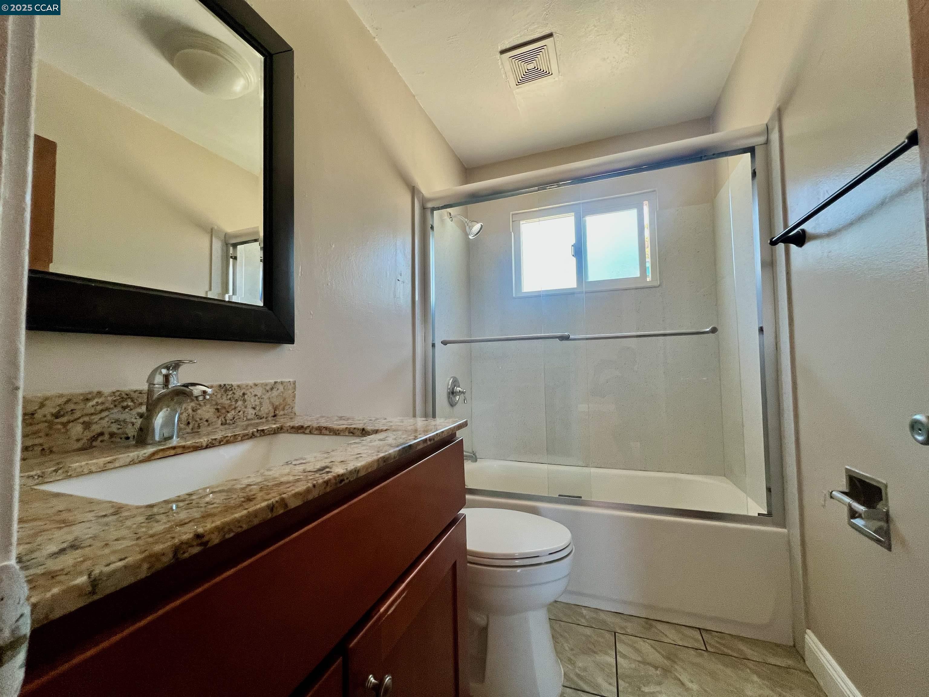 2546 Denning Court Castro Valley, CA 94546 - Photo 10 of 14 a bathroom with a granite countertop sink toilet and shower