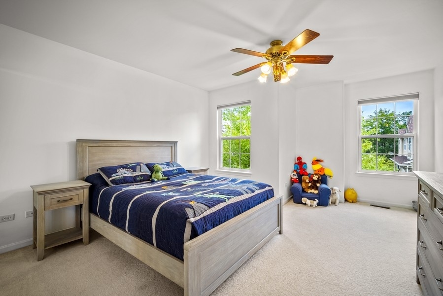 4643 Jenna Road Glenview, IL 60025 - Photo 11 of 17 a bedroom with a bed and a window