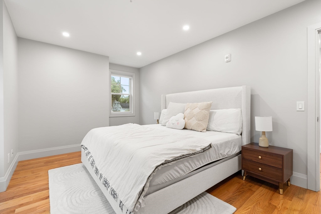 114 Broad Street, Unit D Weymouth, MA 02188 - Photo 16 of 41 a bedroom with a bed and a window