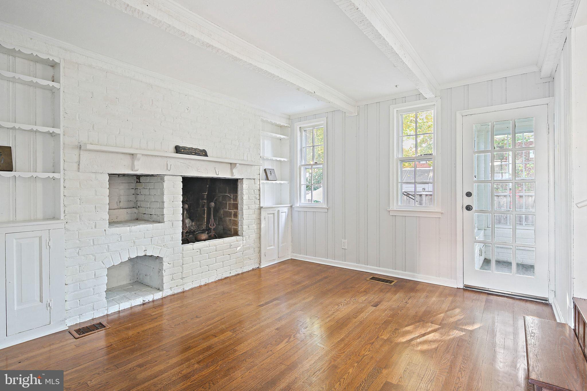 2603 Arcola Avenue Silver Spring, MD 20902 - Photo 14 of 34 a view of an empty room with wooden floor and a window