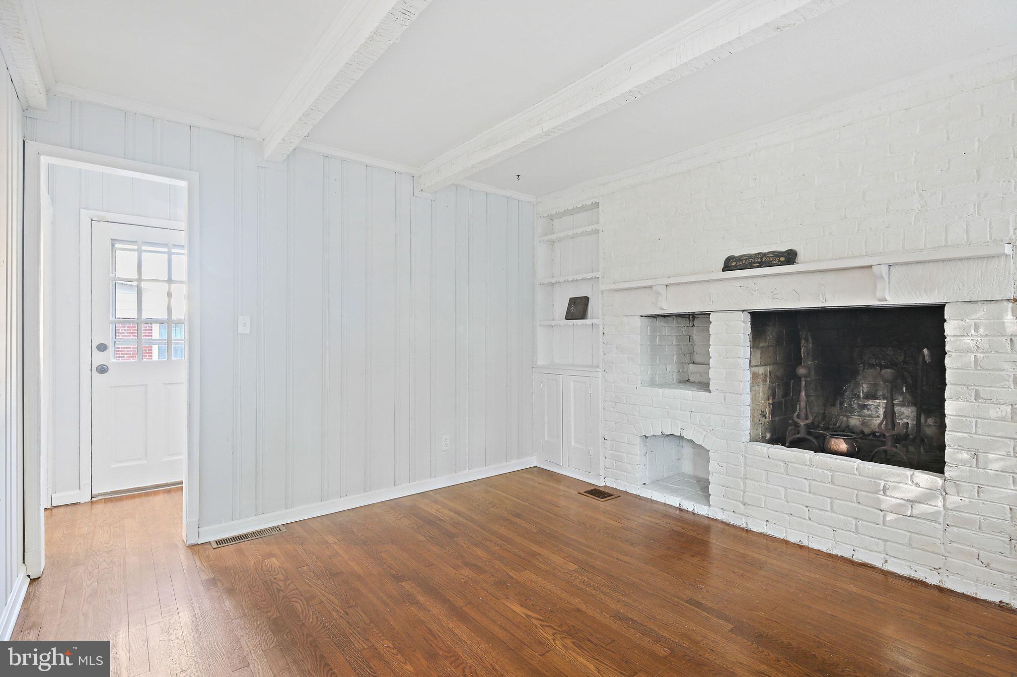 2603 Arcola Avenue Silver Spring, MD 20902 - Photo 17 of 34 a view of empty room with wooden floor and fireplace