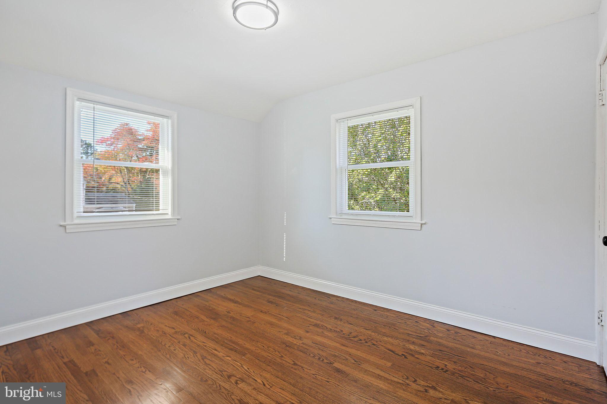 2603 Arcola Avenue Silver Spring, MD 20902 - Photo 21 of 34 a view of a big room with wooden floor and windows