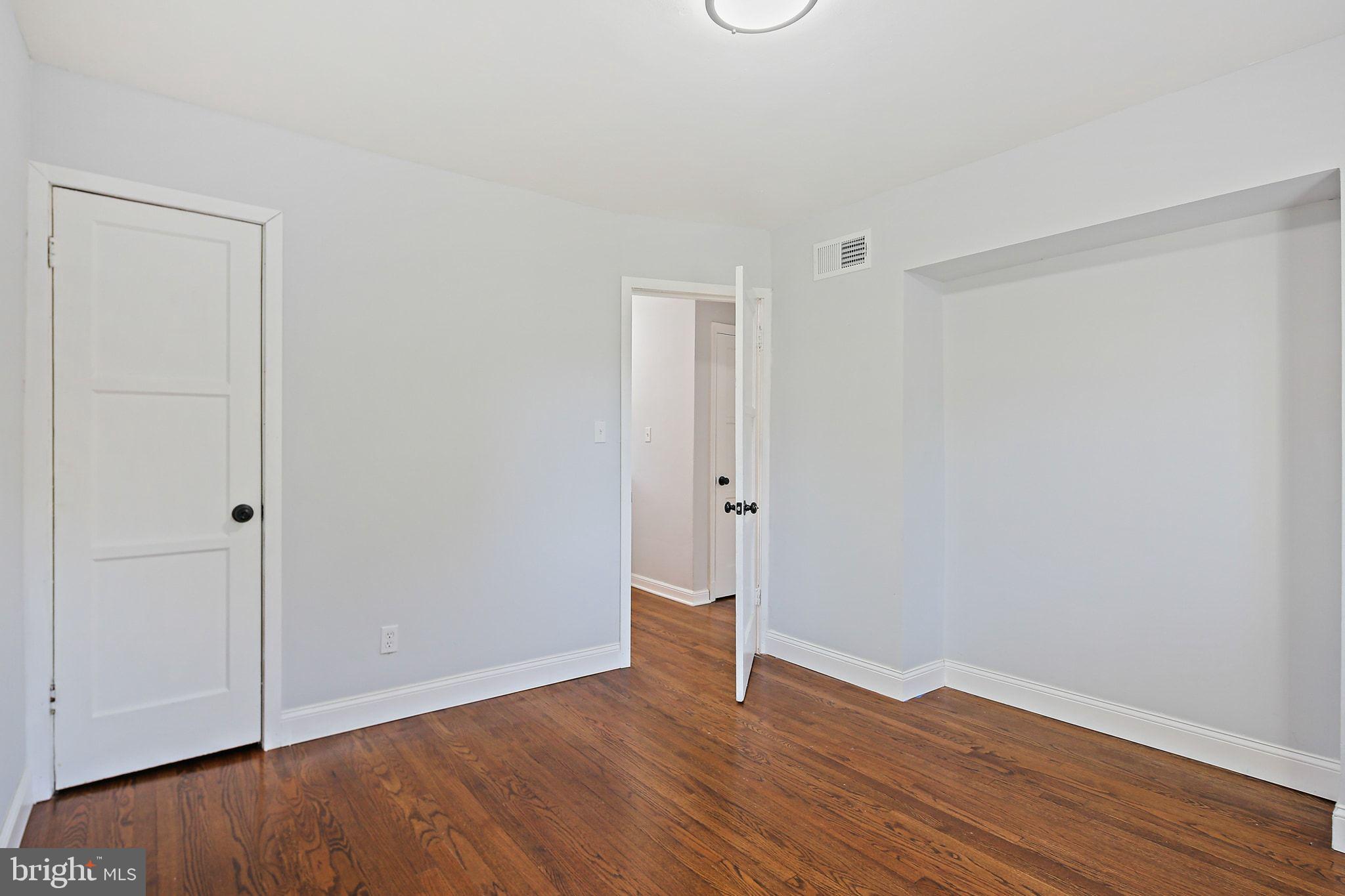 2603 Arcola Avenue Silver Spring, MD 20902 - Photo 22 of 34 a view of an empty room with wooden floor