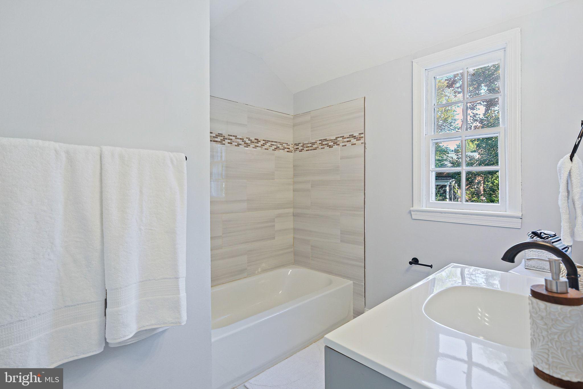 2603 Arcola Avenue Silver Spring, MD 20902 - Photo 24 of 34 a bathroom with a sink and a bathtub