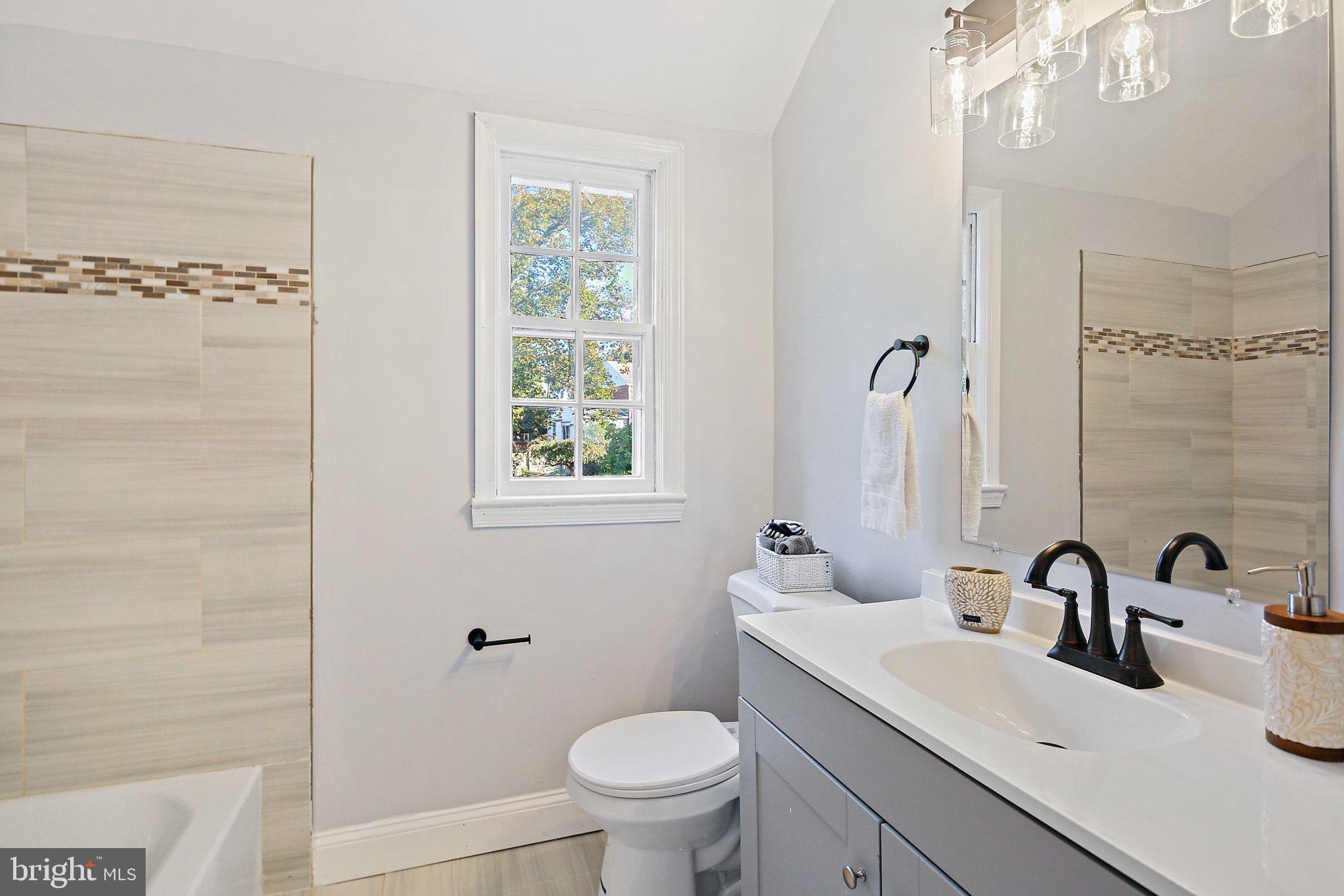 2603 Arcola Avenue Silver Spring, MD 20902 - Photo 25 of 34 a bathroom with a sink toilet and shower