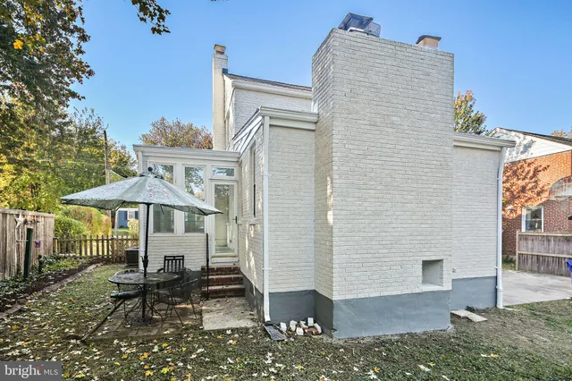 a front view of a house with wooden fence