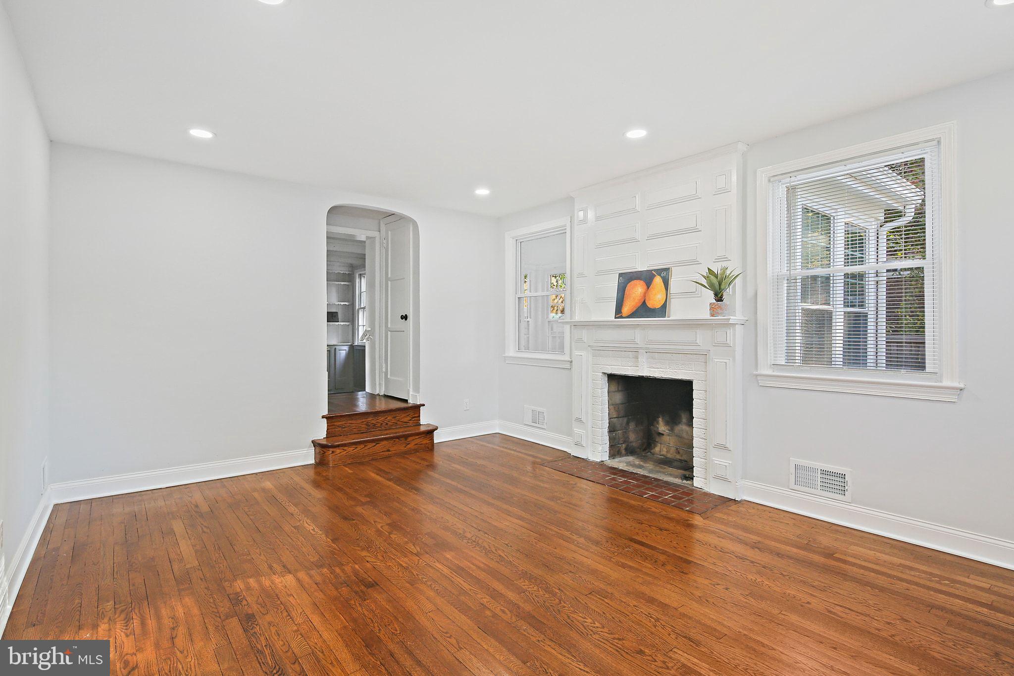 2603 Arcola Avenue Silver Spring, MD 20902 - Photo 4 of 34 a view of an empty room with wooden floor and a window