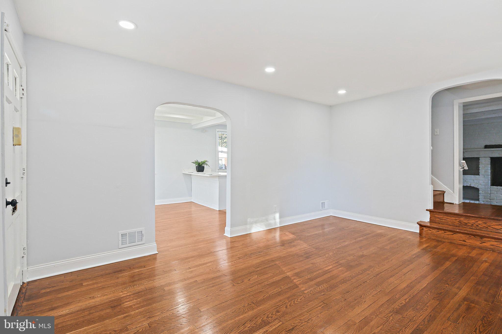 2603 Arcola Avenue Silver Spring, MD 20902 - Photo 5 of 34 wooden floor in an empty room with a window