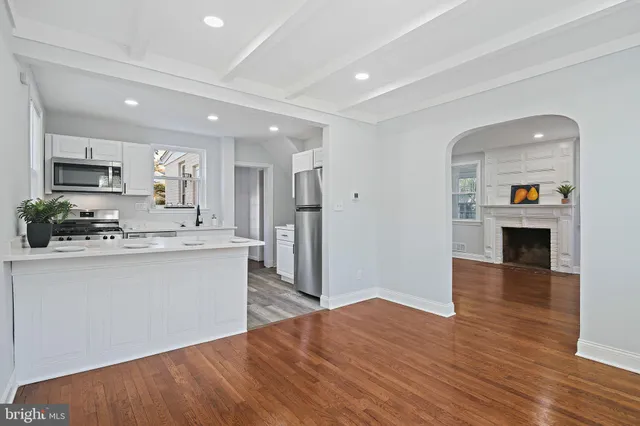 a view of kitchen with sink microwave and stove