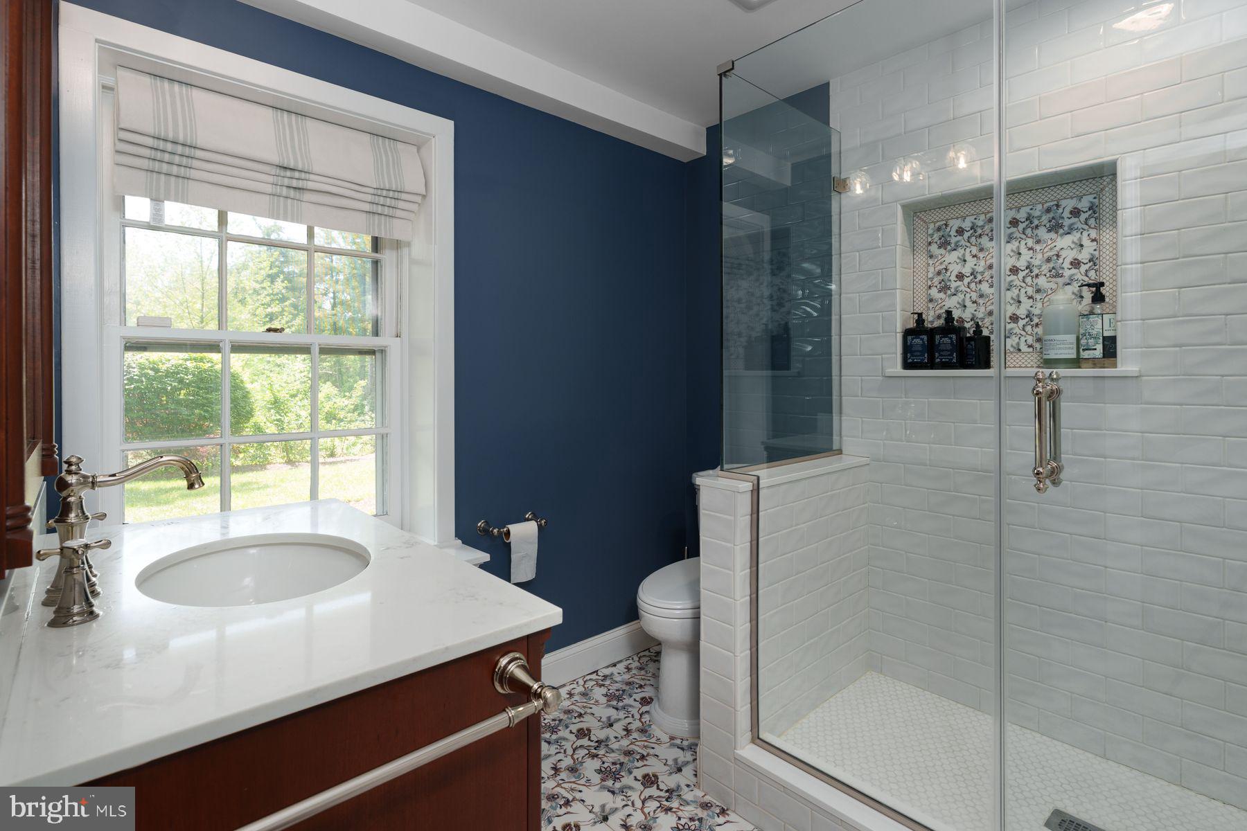 821 Pretty Brook Road Princeton, NJ 08540 - Photo 21 of 32 a bathroom with a sink toilet and shower