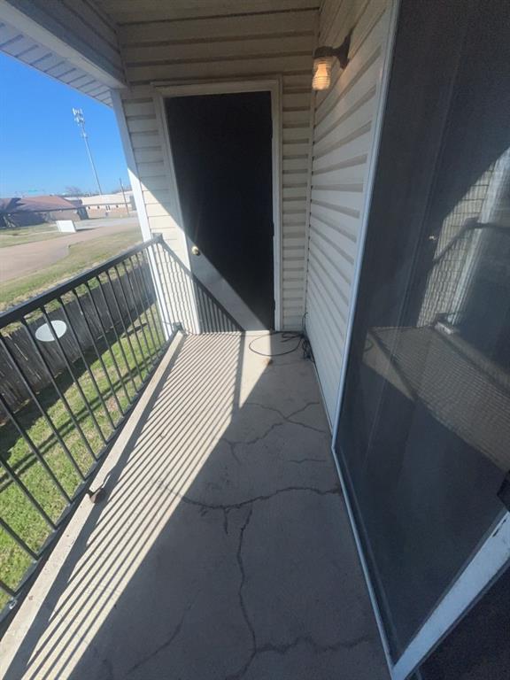 125 Northeast Johnson Avenue, Unit 30 Burleson, TX 76028 - Photo 5 of 13 View of balcony