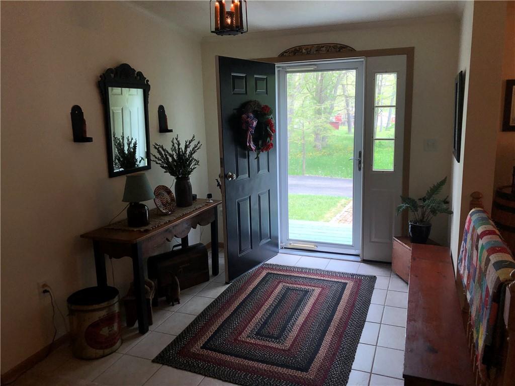 661 Nelson Road Farmington, PA 15437 - Photo 12 of 50 a living room with furniture fireplace and flat screen tv