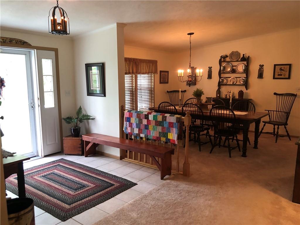 661 Nelson Road Farmington, PA 15437 - Photo 13 of 50 a living room with furniture and a chandelier