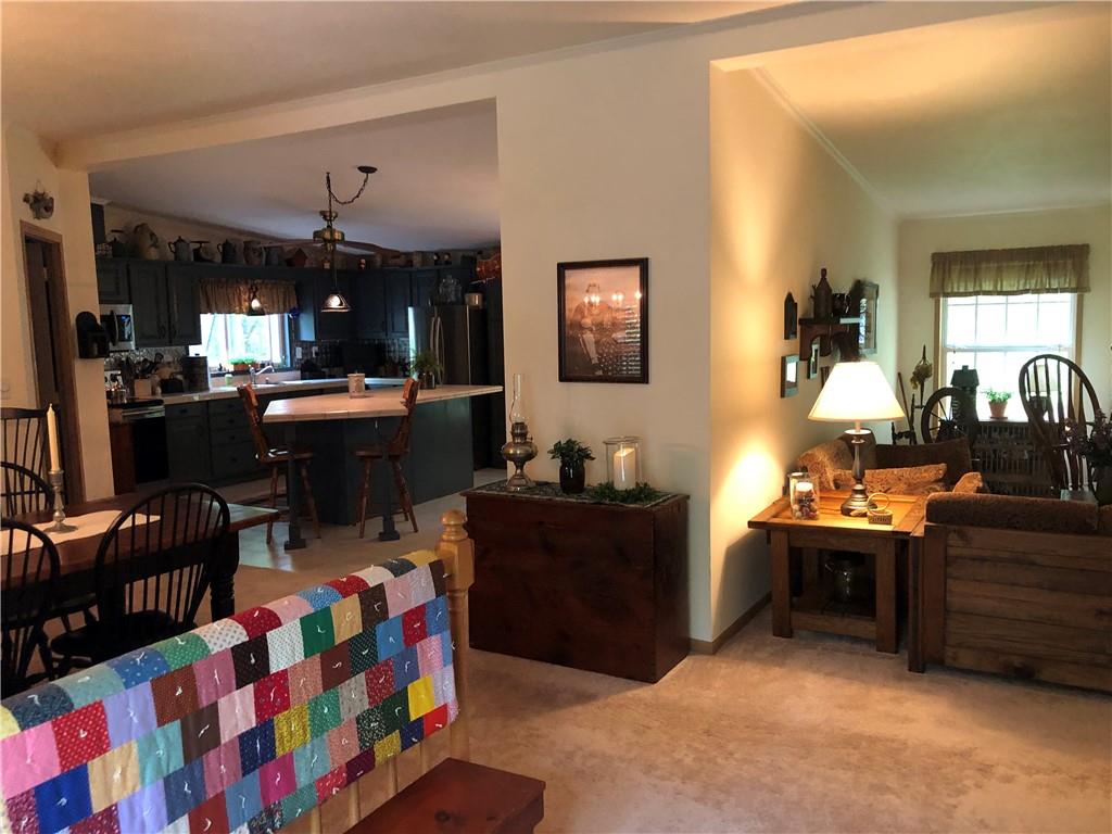 661 Nelson Road Farmington, PA 15437 - Photo 14 of 50 a very nice looking living room with kitchen and furniture