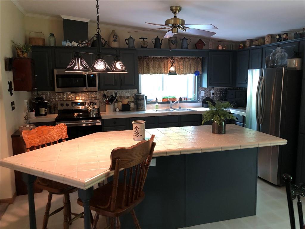 661 Nelson Road Farmington, PA 15437 - Photo 18 of 50 a dining table with chairs and window
